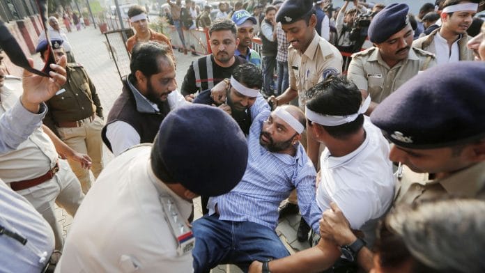Police detain NSUI supporters during a protest against the Citizenship Amendment Act in Ahmedabad, Dec. 18, 2019. | PTI