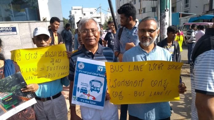 People hold placards protesting against traffic in Bengaluru | Twitter @BBPVedike