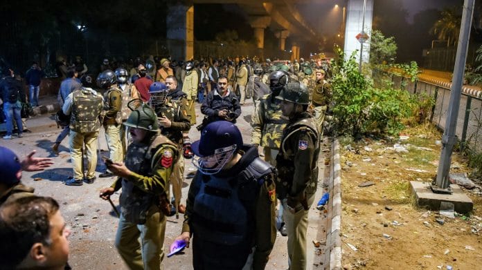Policemen stand guard near Jamia Millia Islamia following the protests against Citizenship Amendment Act, in New Delhi, Sunday, Dec. 15, 2019. | PTI