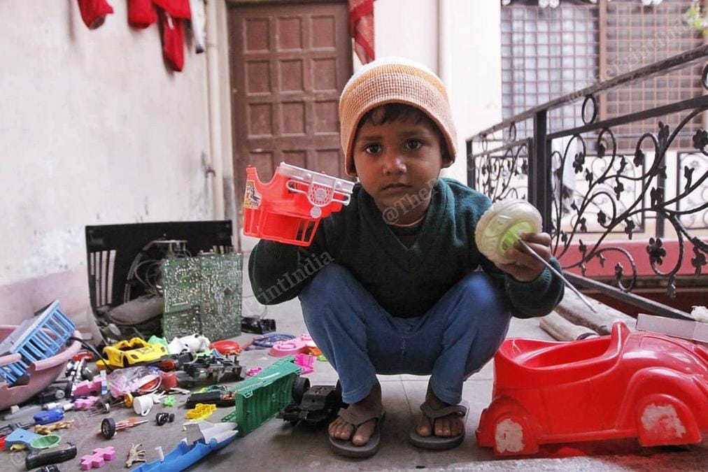 Razia Khatoon's grandson with broken toys. | Photo: Praveen Jain/ThePrint