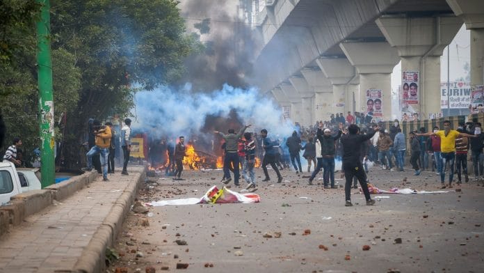 Brick-bats lie on a road as Anti-CAA (Citizenship Amendment Act) protestors clash with the police at Seelampur in New Delhi, Tuesday. | PTI