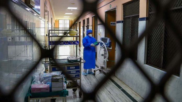 Hospital staff is seen outside the Special Isolation Ward at the Rajiv Gandhi Government General Hospital in Chennai