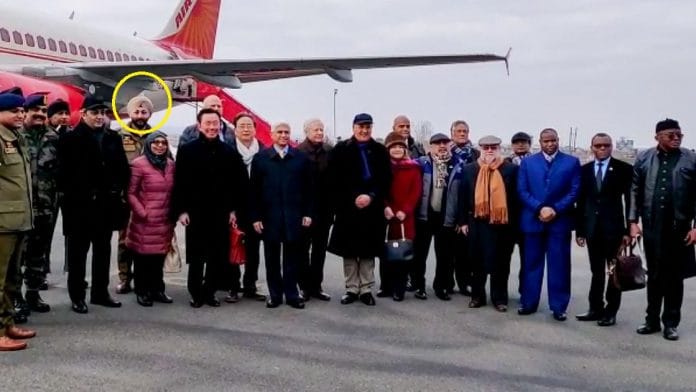 DSP Davinder Singh (in turban behind envoy in pink jacket) at Srinagar airport where he met envoys from 15 countries Thursday | PTI