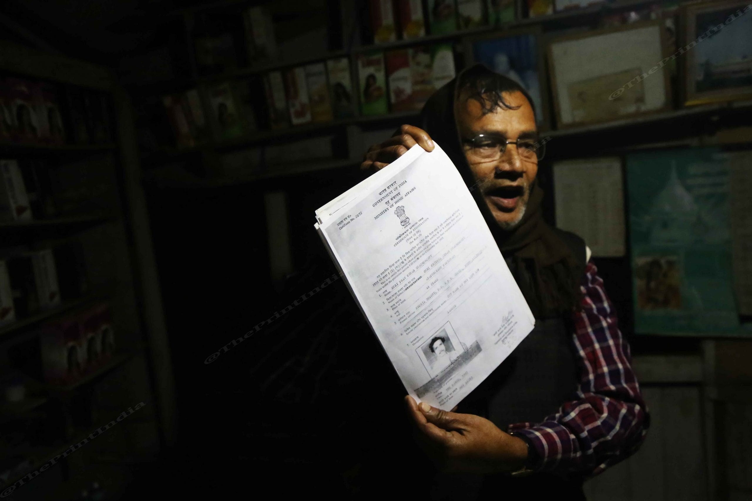 Prasad Mandal showing the many forms he has filled over the years to obtain Caste certificate | Photo: Manisha Mondal | ThePrint