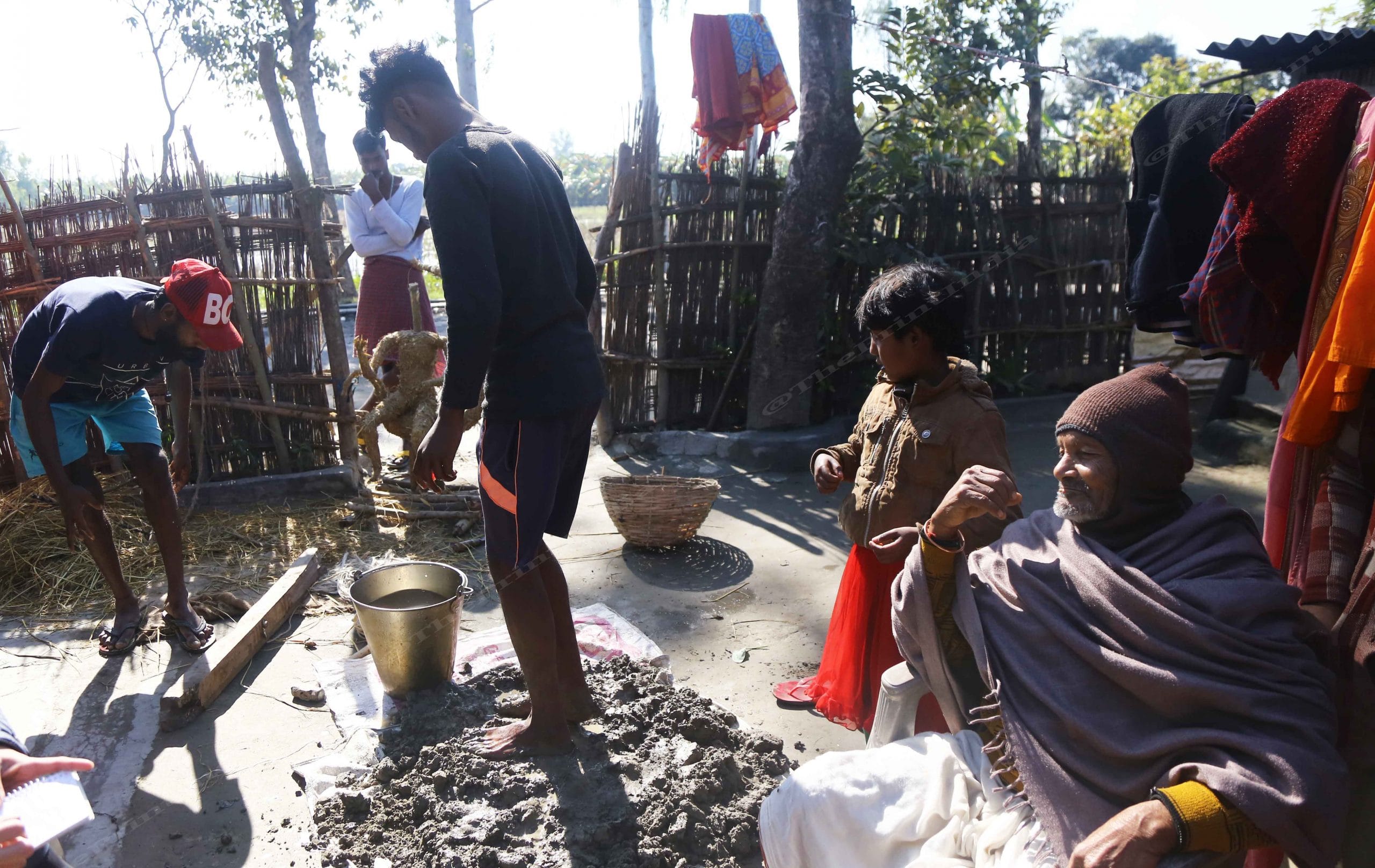 Bharat Bishwas next to a boy preparing Goddess Saraswati's idol for upcoming Saraswati Puja | Photo: Manisha Mondal | ThePrint