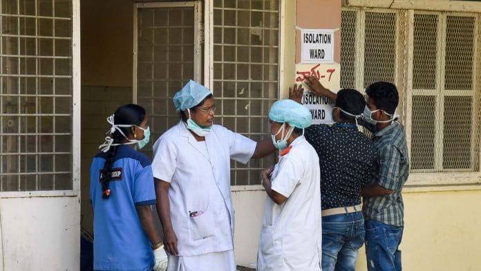 Hospital staff is seen outside the Special Isolation Ward set up for suspected cases of coronavirus in Hydebarad