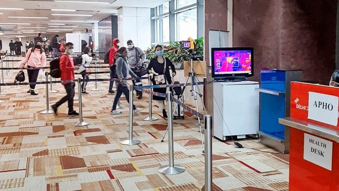 A thermal screening device checks passengers arriving in India from China, in view of the coronavirus outbreak, at Delhi international airport | PTI Photo