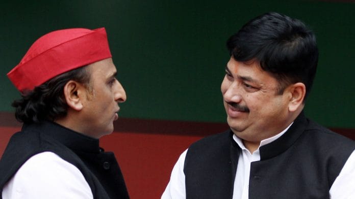 Samajwadi Party National President Akhilesh Yadav interacts with Former chief of Hindu Yuva Vahini Sunil Singh as he joined Samajwadi Party, at the party office in Lucknow on Saturday. | ANI