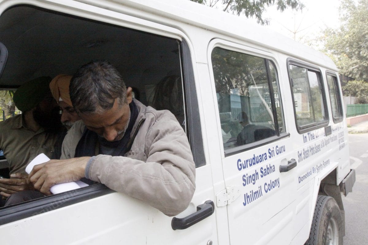 Babu Khan, taking dead bodies of both his sons back home. In his hand, he holds the papers declaring death of his sons | Photo: Praveen Jain | ThePrint
