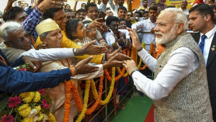 Prime Minister Narendra Modi meets people at the closing ceremony of the Centenary Celebrations of Shri Jagadguru Vishwaradhya Gurukul at Jangamwadi Math in Varanasi | PTI