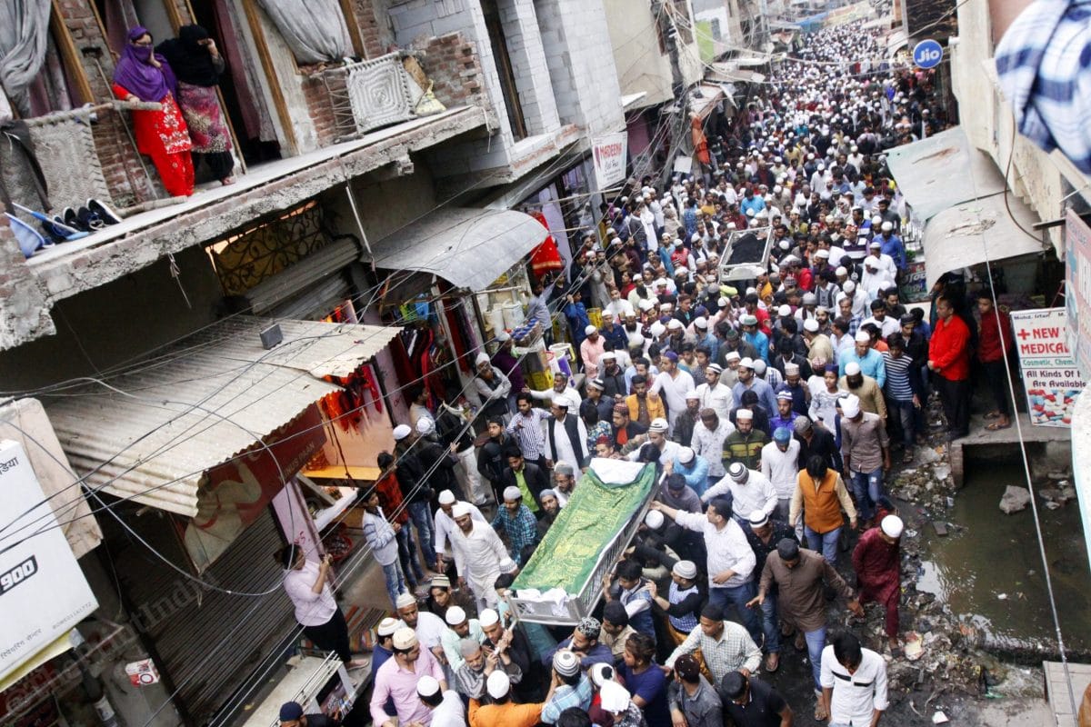 Both bodies are then put on a cot outside their home in Old Mustafabad, while thousands pour in to pay their condolences to the family | Photo: Praveen Jain | ThePrint