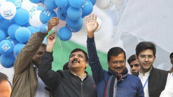 AAP chief Arvind Kejriwal greets people at the party headquarters after winning the Delhi elections | Photo: Praveen Jain | ThePrint