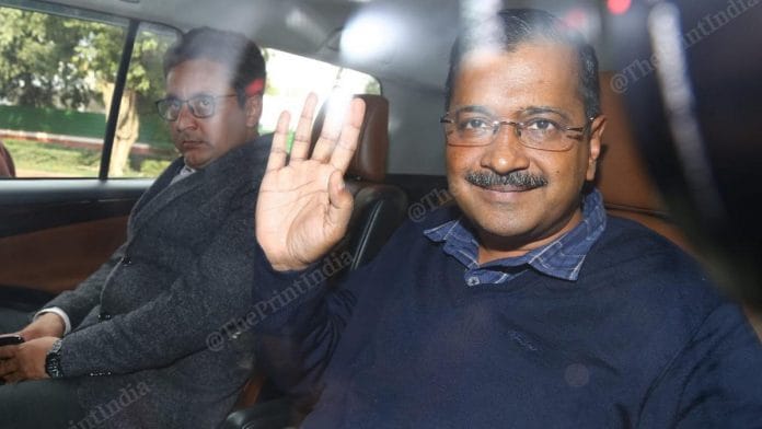 Kejriwal waves from a car