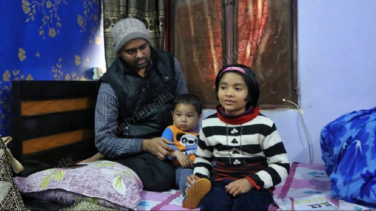 Jamia Millia Islamia student Mohammed Minhajuddin with his nephew and niece at his sister's home in New Delhi | Photo: Manisha Mondal | ThePrint