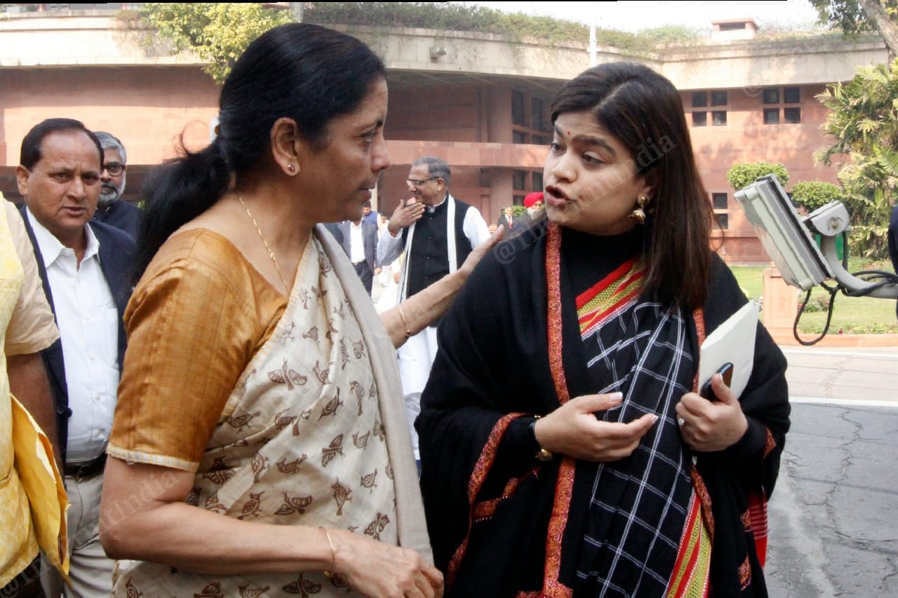 Nirmala Sitharaman talking to BJP lawmaker Poonam Mahajan after the party's parliamentary meet in New Delhi