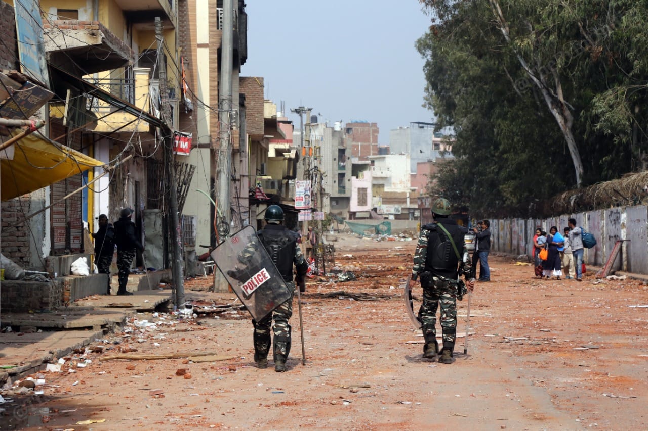 Delhi Police personnel on patrol in Mustafabad Wednesday 