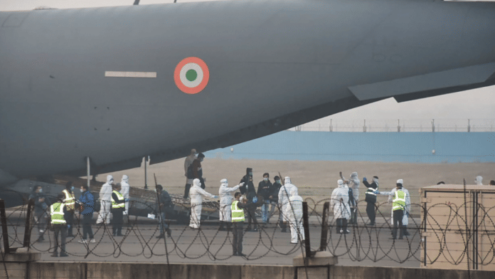 Indian and foreign nationals evacuated from Wuhan on a military plane | PTI
