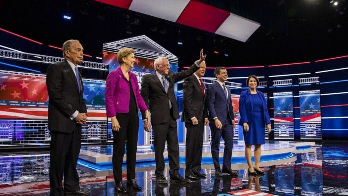 2020 presidential candidates Mike Bloomberg, Senator Elizabeth Warren, Senator Bernie Sanders, former Vice President Joe Biden,(Fourth from left) Pete Buttigieg, and Senator Amy Klobuchar stand on stage ahead of the Democratic presidential candidate debate in Las Vegas, Nevada, US. | Joe Buglewicz | Bloomberg