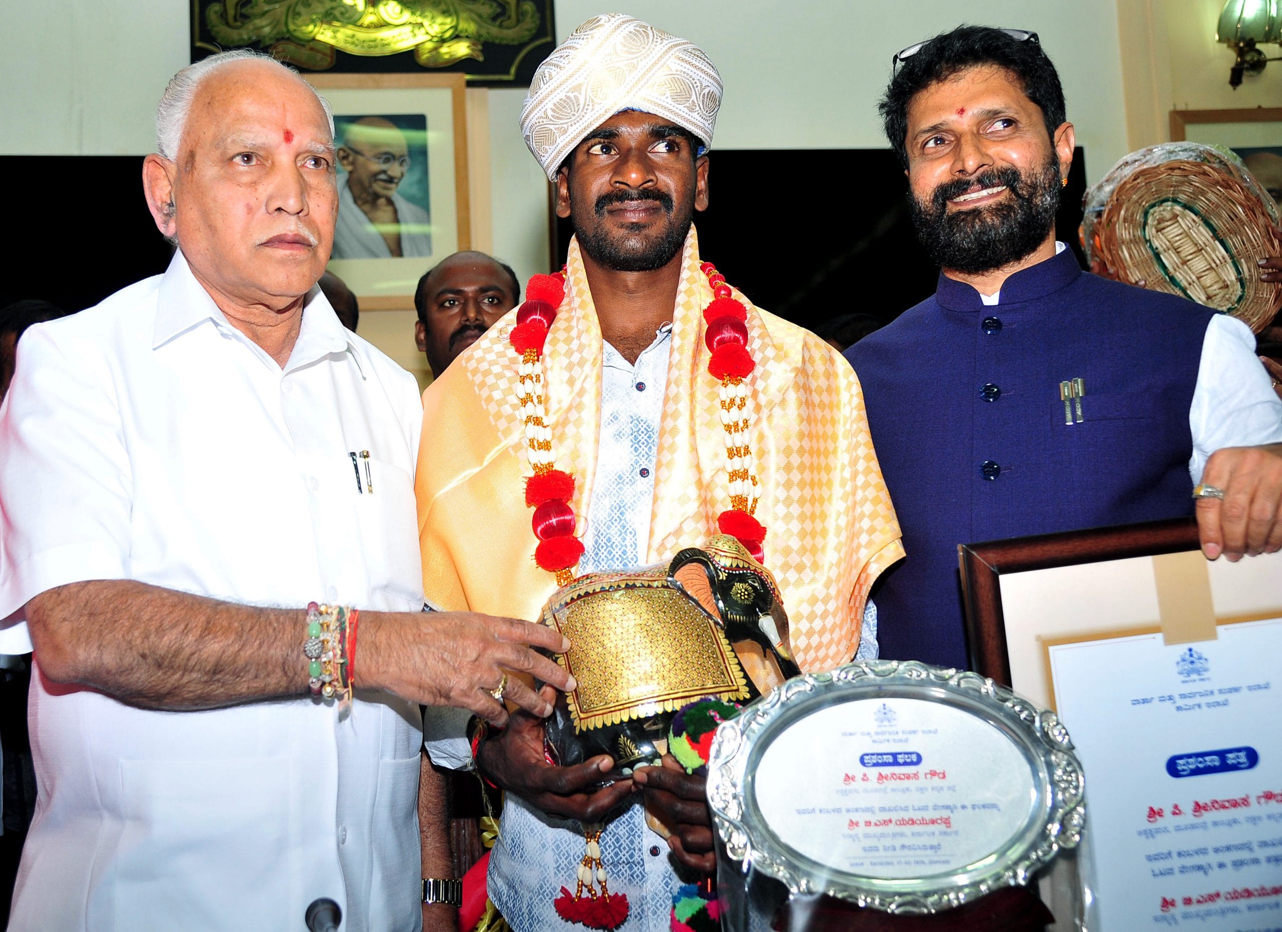 Karnataka Chief Minister B.S. Yediyurappa felicitating Srinivasa Gowda from Mangaluru on Monday. | Photo: ANI
