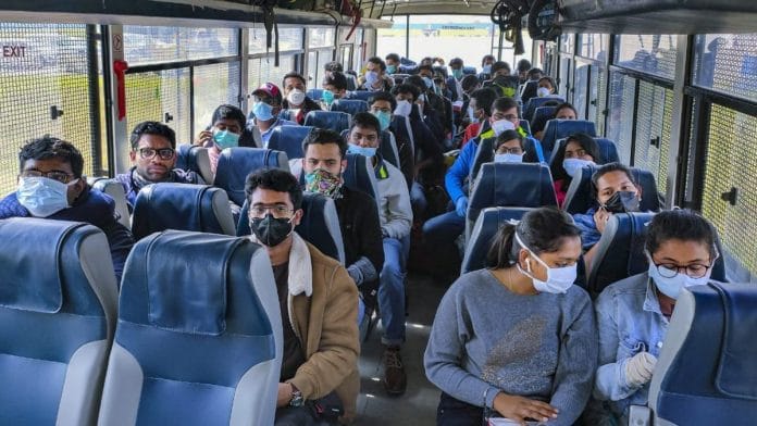 Evacuees airlifted from Rome, Italy on their arrival at IGI airport, before being sent to a quarantine facility in New Delhi on 22 March | Photo: PTI