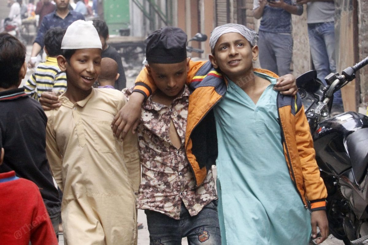 Young boys of Mustafabad, meeting their friends after a week-long period of terror and dread | Photo: Praveen Jain | ThePrint