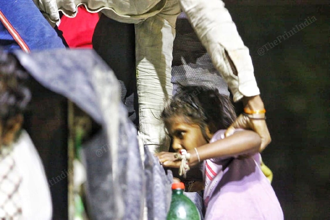 A kid with her father | Photo: Praveen Jain | ThePrint