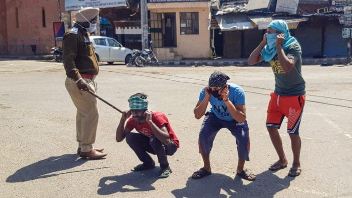 Amritsar Police punish offenders for flouting the lockdown guidelines, on the first day of the 21-day nationwide lockdown on 25 March | PTI