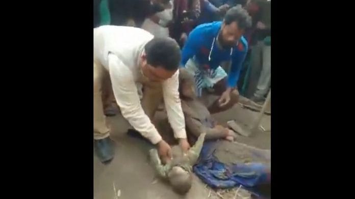 People dig up the bodies of a 21-year-old woman and her baby | Screengrab | Twitter