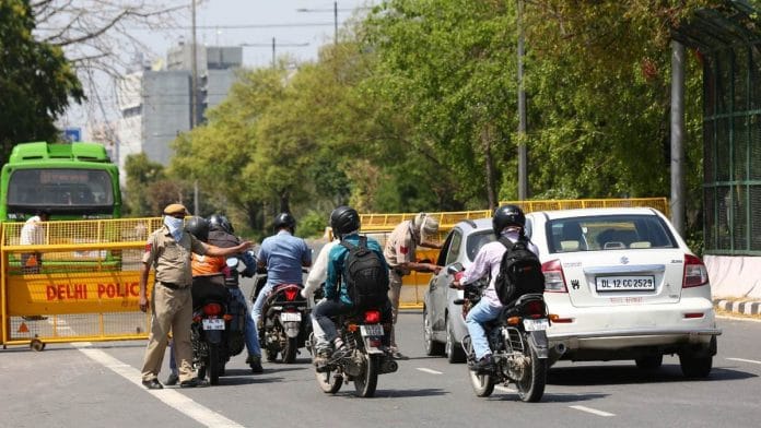 Only employees engaged in 'essential services' are allowed to be on the roads during the 21-day coronavirus lockdown in India | Photo: Suraj Singh Bisht | ThePrint
