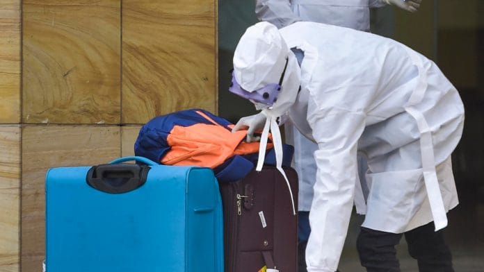 A suspected coronavirus patient shifts to the isolation ward of Safdarjung hospital after going through scanning at the airport, in New Delhi on 4 March | PTI Photo
