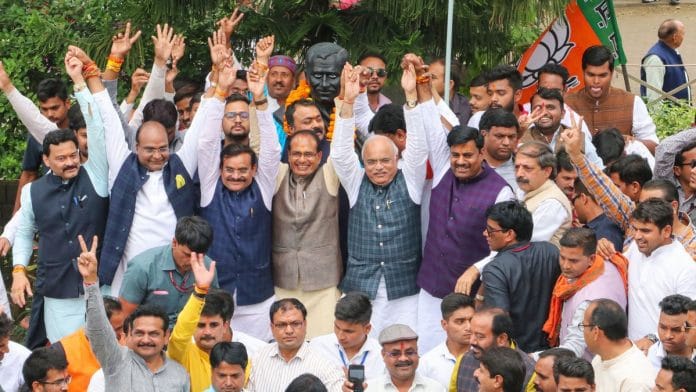 BJP leaders Shivraj Singh Chouhan, V.D. Sharma, Gopal Bhargava and others celebrate at the party headquarters in Bhopal after Madhya Pradesh CM Kamal Nath's resignation Friday