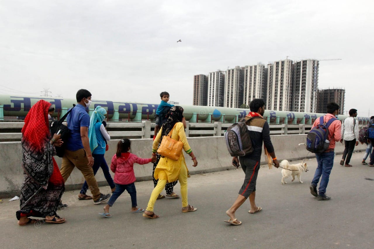 People walk back to their villages along the Delhi-Meerut Expressway. The lockdown has shut all means of interstate public transport | Praveen Jain | ThePrint