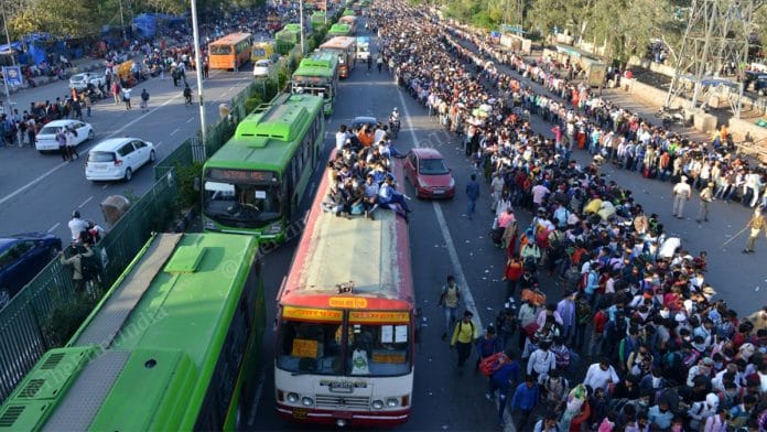 Migrant workers fleeing Delhi to their native villages after lockdown announcement | Photo: Suraj Singh Bisht | ThePrint