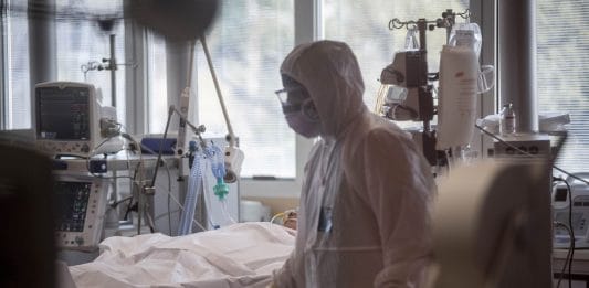 A doctor works in a coronavirus isolation wing in a hospital in Rome, Italy. | Bloomberg