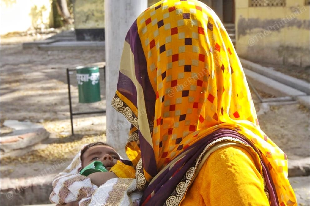 A woman inmate of the Agra district jail with her year-old son 