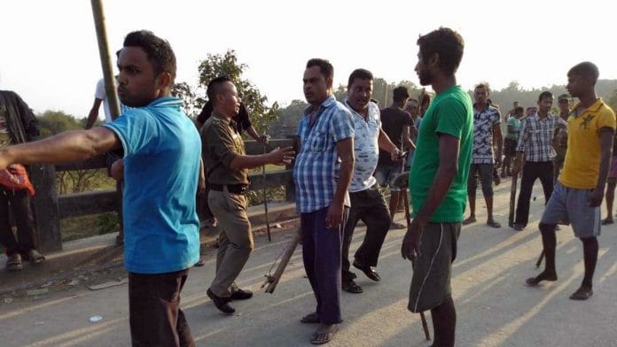 Protesters during a clash between Khasi and Non tribal those against and supporting the Citizenship (Amendment) Act at Ichamati village in Meghalaya on Friday. | ANI