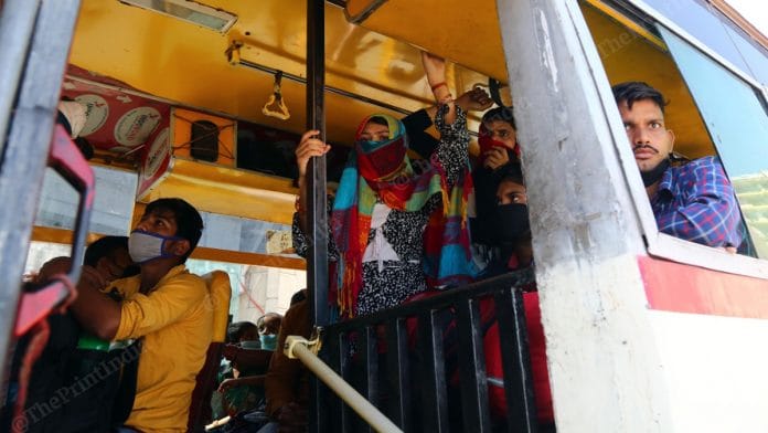 Migrants in Delhi boarding buses to go back to their villages | Photo: Suraj Singh Bisht | ThePrint