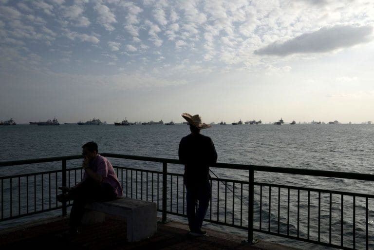 Singapore’s coastline is packed with ships full of oil no one wants
