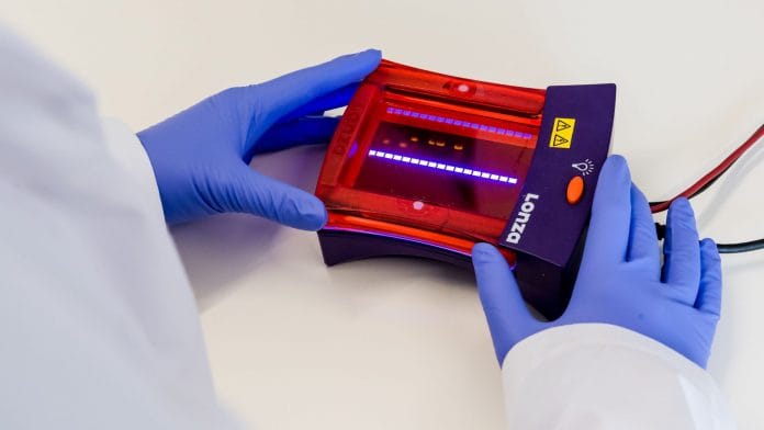 A laboratory worker uses a gel electrophoresis analysis machine on a sample from a coronavirus patient who has since recovered from the virus in the virology research labs at UZ Leuven university hospital in Leuven, Belgium, on Friday, Feb. 28, 2020. Photographer: Geert Vanden Wijngaert/Bloomberg