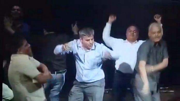 A screengrab from the viral video purportedly showing advocate Pratap Singh (centre) dancing to 'Disco dancer'. The lawyer has denied it's him in the video | By special arrangement