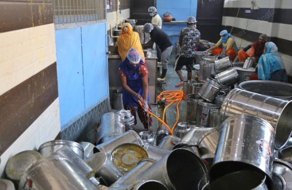 The dedicated washing staff cleans roughly 1,200 utensils a day in a designated washing area. Photo: Manisha Mondal | ThePrint