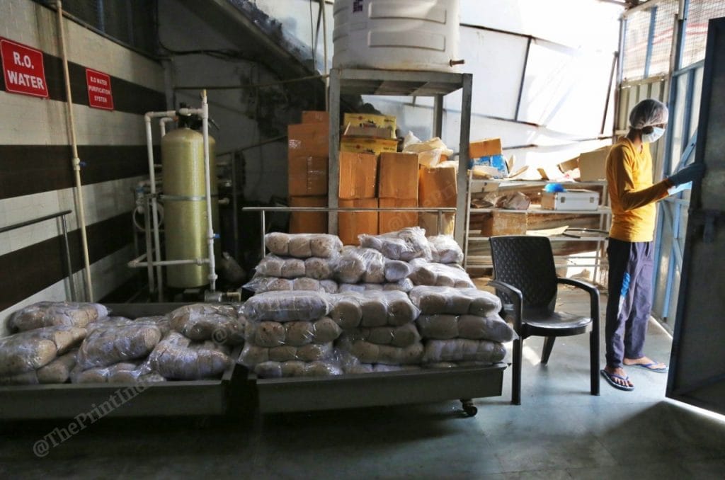 Packets of rotis readied to be loaded into lorries to be distributed across South Delhi. Photo: Manisha Mondal | ThePrint