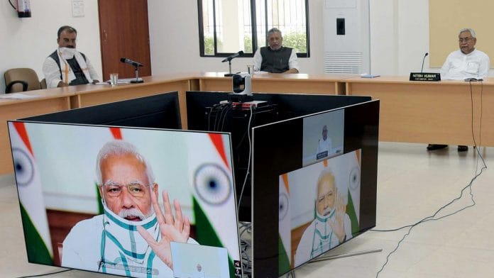 Bihar CM Nitish Kumar (right) and Deputy CM Sushil Modi (back, centre) in Monday's video conference with PM Narendra Modi | Photo: ANI