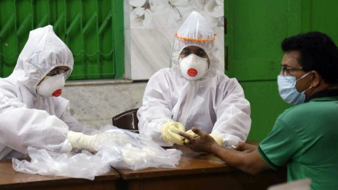 A special team of doctors from SSKM Hospital in West Bengal conducts a rapid antibody test to check the spread of coronavirus, in Kolkata on 21 April 2020 | ANI