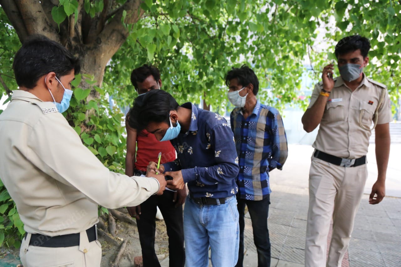 Kumar and his friends sign the document apologising for violating the lockdown | Photo: Manisha Mondal | ThePrint