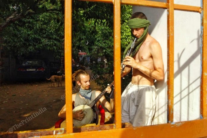 Tourists trapped in lockdown at Pushkar's Moon Café hotel play music to pass the time. Photo: Praveen Jain | ThePrint