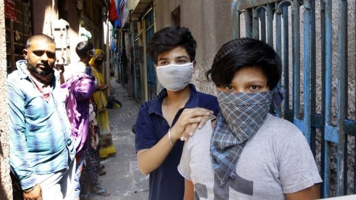 Two young boys who haven't been tested in Ahmedabad's Behrampur locality. Four members of their family have tested positive for Covid-19. | Photo: Praveen Jain/ThePrint