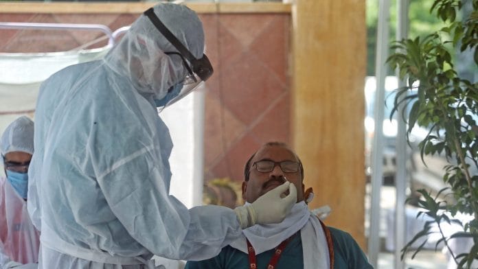 Representational Image | A doctor collects sample from a person for Covid-19 testing | Photo: Shrikant Singh/ANI
