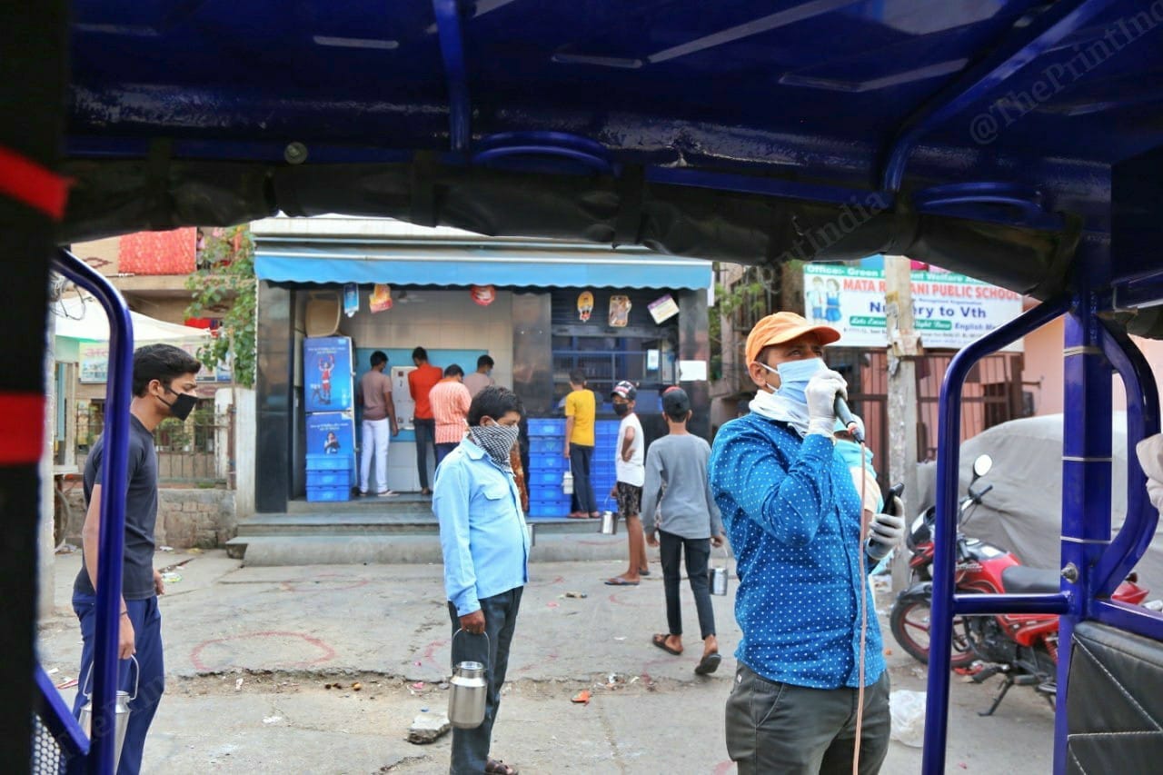 Offiical Sanjay Kumar making an announcement in Jahangirpuri, New Delhi. | Photo: Manisha Mondal/ThePrint
