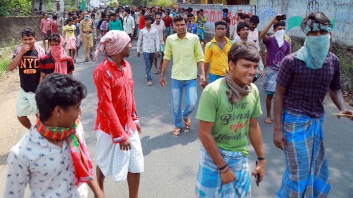 A file photo of migrant workers who gathered at Payippad in Kottayam to demand travel arrangements for their home states amid a nationwide lockdown. | Photo: ANI